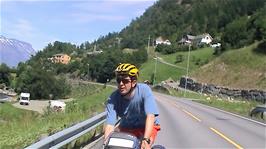 Michael coasts into the Brakavik "Services" at Fresvik for lunch, 10.1 miles into the ride
